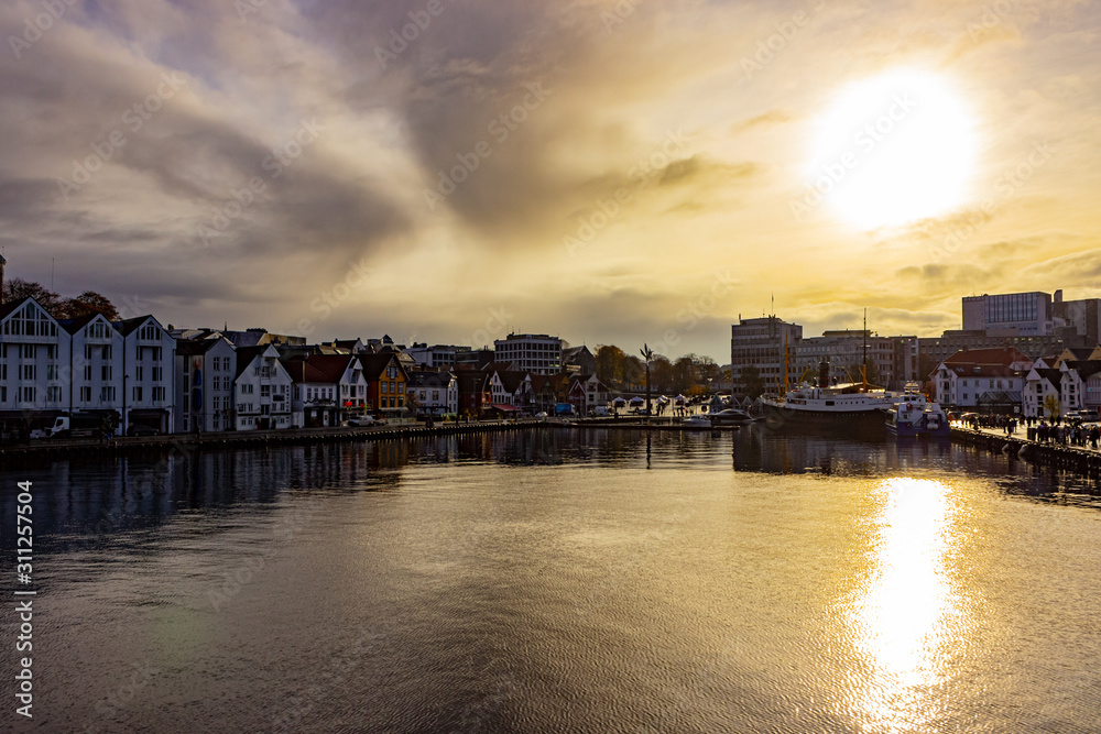 Beautiful view at Stavanger harbour on a cloudy day after the rain stopped and the sun broke through the clouds, Norway