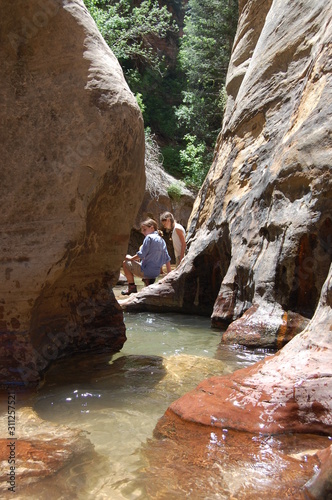 Hiking through red rocks and emerald pools