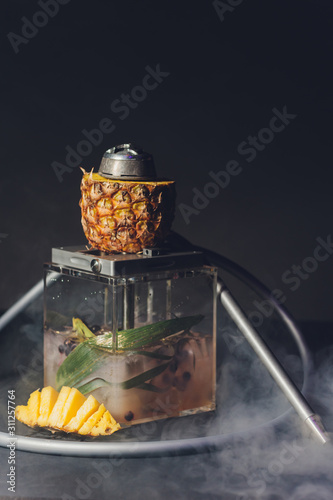 Shisha With Fruit Bowl With Colorful Smoke In Hookah Bar Closeup. photo