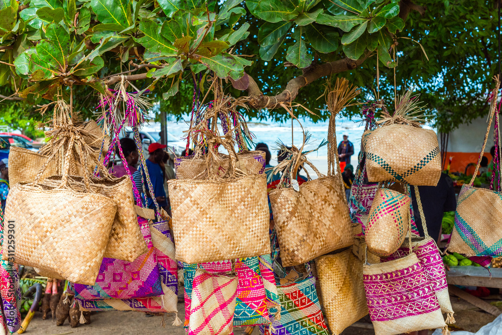 Wicker bags on sale in the local market, Tanna Island, Vanuatu. - obrazy, fototapety, plakaty 