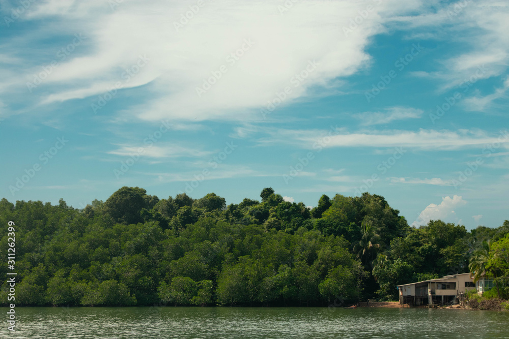 A small traditional home on the water in thailand