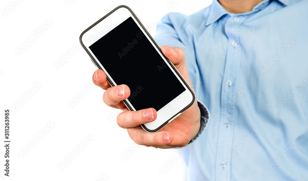 Phone in hand on a white background. A man holds a phone with a blank display in his hand. The concept of supplementing content, providing information.
