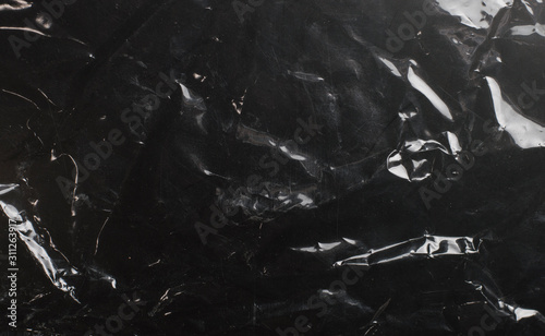 glossy polyethylene on a dark background