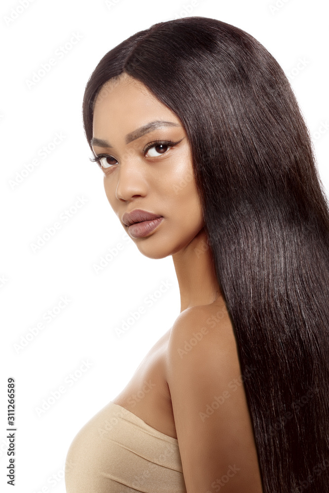 Beauty black skin woman African Ethnic female face. Young african american model with long hair Beauty black skin woman African Ethnic female face. Young african american model with long hair