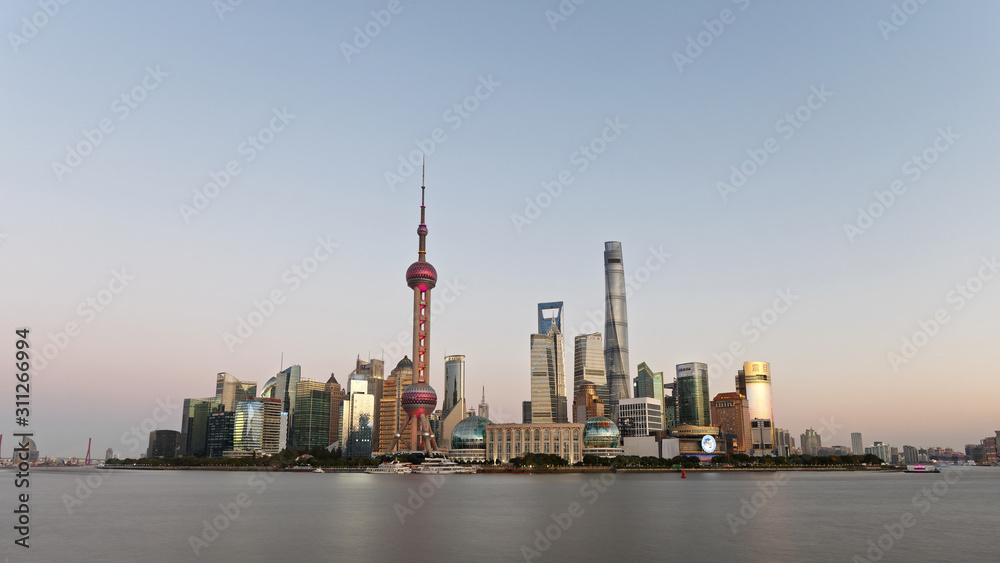 beautiful Shanghai Lujiazui Cityscape with blue sky background viewed from the bund in sunset.