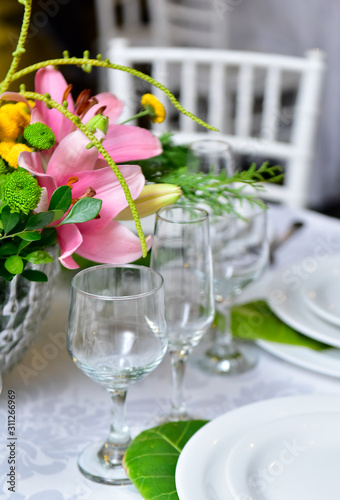 elegant table setting, glass goblets, water and wine glasses, banquet