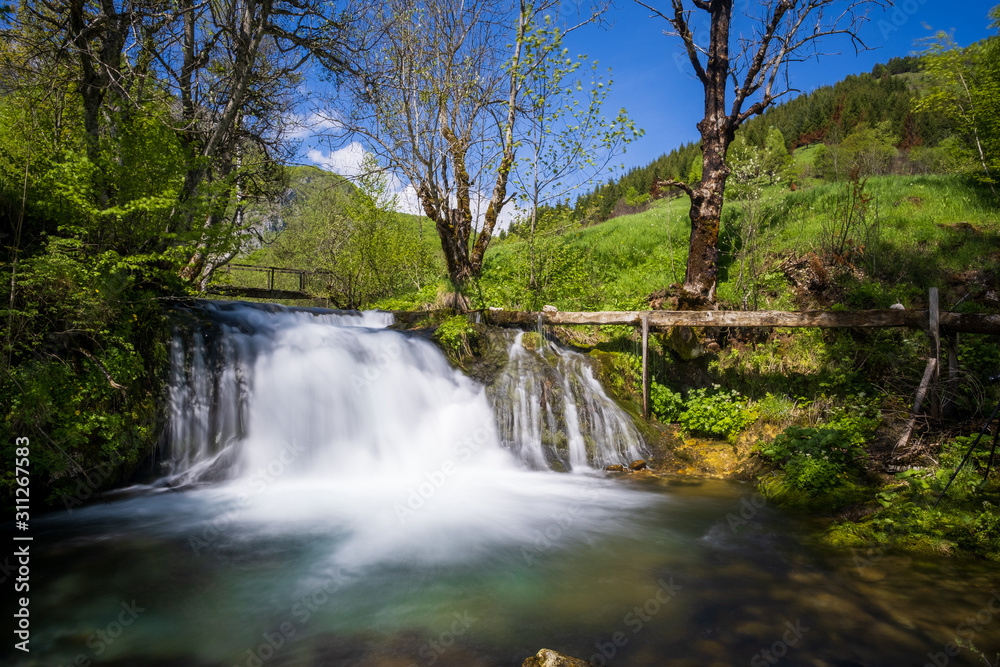 Waterfall on a mountain river in spring. Waterfall on a mountain river in spring.