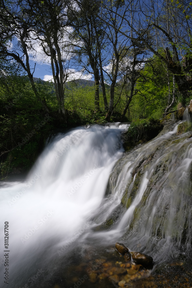 Waterfall on a mountain river in spring. Waterfall on a mountain river in spring.