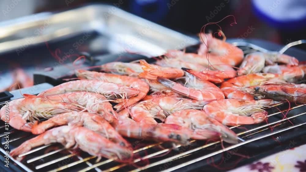 The grilled shrimp close up on the grill The grilled shrimp close up on the grill