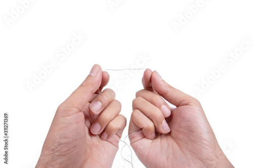 Hand holding dental floss isolated on white background. For polishing teeth