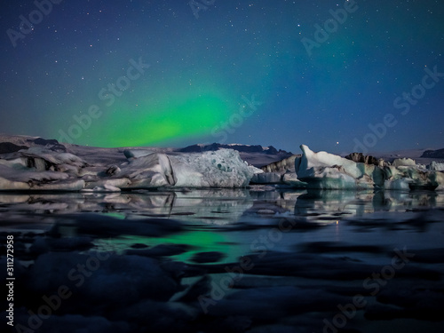 Artic light (aurora borealis) over jokulsarlon, iceland photo