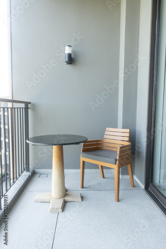 wood chair and table on balcony