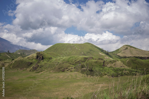 Bondowoso, East Java / Indonesia Savana Wurung Crater (Kawah Wurung) during the dry season, located in Curah Macan village, Bondowoso. photo