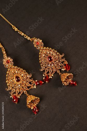 Authentic Traditional Indian Jewellery Earrings On Dark Background. Wear in Ears in Wedding, Festivals And Other Occasion. Very Useful Image For Website, Printing & Mobile Application.