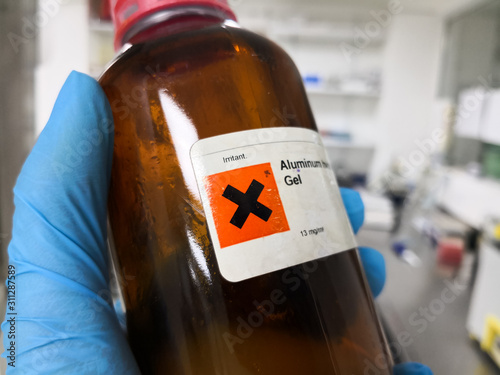 Dangerous and irritating chemical inside an amber bottle in a laboratory