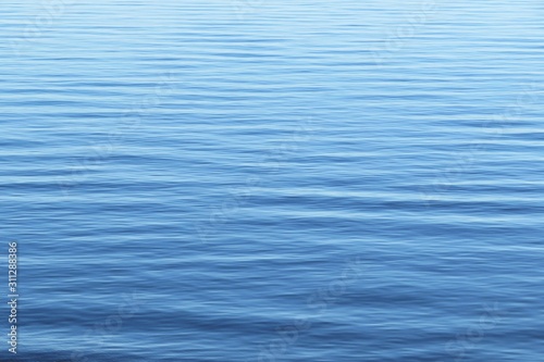 Fototapeta Naklejka Na Ścianę i Meble -  Smooth surface light blue water on Florida river, natural background 