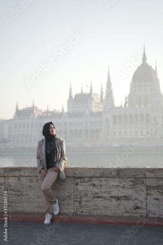 Photography a model posing against a background and beautiful city buildings of budapes