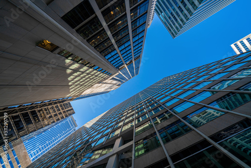 Foto Modern office glasses buildings cityscape under blue clear sky in Washington DC,