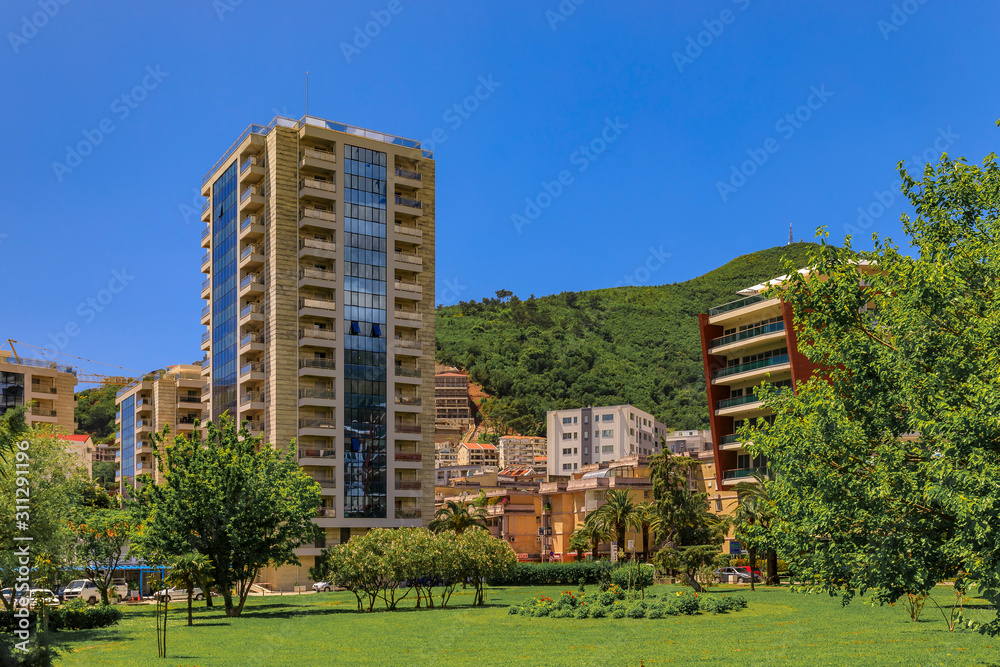 Picturesque park and modern residential apartment buildings in Budva Montenegro in the Balkans on the Adriatic Sea