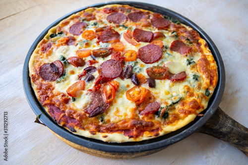 Chorizo, tomato and mozzarella cheese pizza