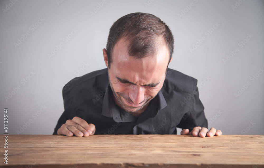 Obraz premium Caucasian businessman crying in office.