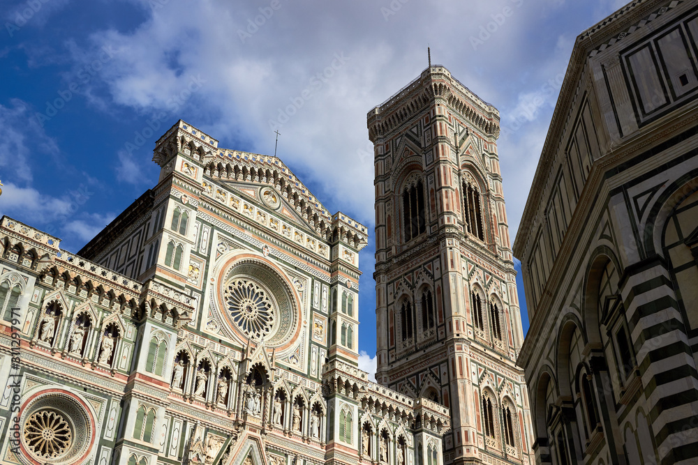 Detail of the facade of the Basilica di Santa Maria del Fiore (Florence Cathedral or Cathedral of Saint Mary of the flower), the main church of Florence, Italy. Bottom view.