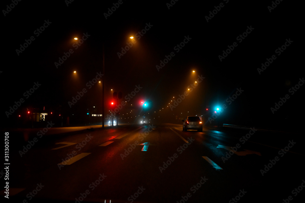 traffic light a dark and foggy night in Karlskoga Sweden