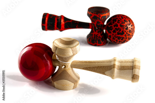 Kendama japanese wooden toy on isolated on white. Wood toy s in black and orange color and traditional bamboo wood photo