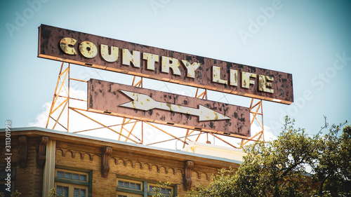 Tableau sur toile Street Sign to Country Life