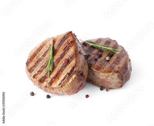 Delicious grilled beef medallions with rosemary and peppers mix isolated on white