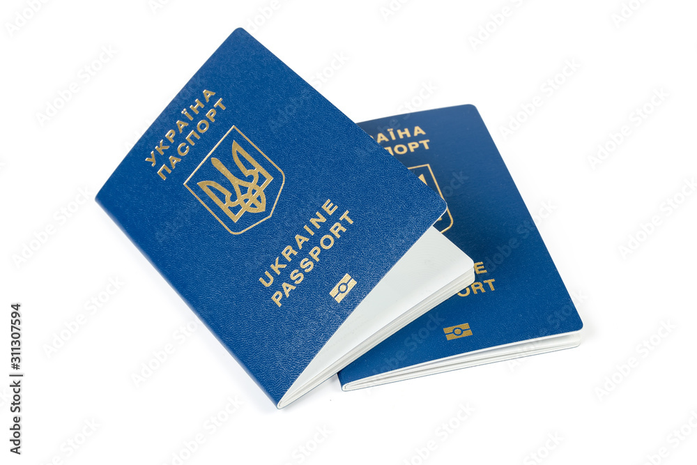 Two ordinary biometric Ukrainian passports on a white background Two ordinary biometric Ukrainian passports on a white background