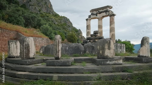 Tholos with Doric columns at the Athena Pronoia temple ruins in Delphi, Greece photo