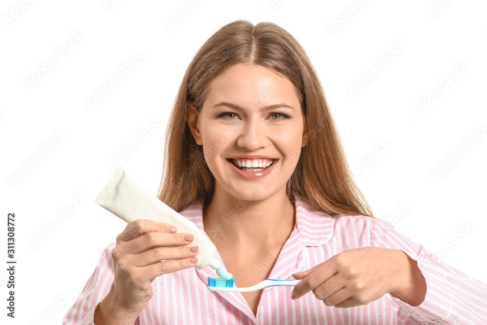Young woman with toothbrush and paste on white background Young woman with toothbrush and paste on white background