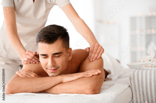 Handsome man having massage...