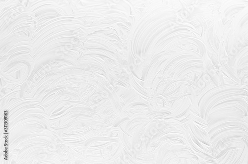 White shabby dry scratched paint texture with curly curved lines as modern abstract background.