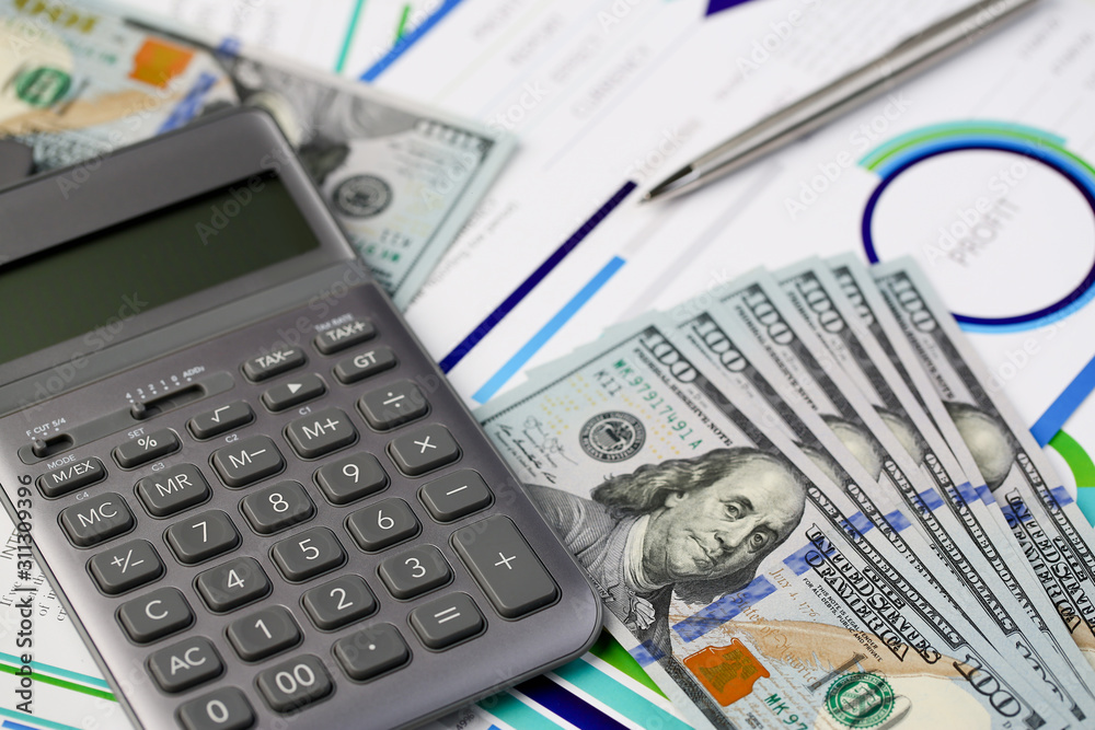 Silver calculator with gray keyboard is lying Silver calculator with gray keyboard is lying
