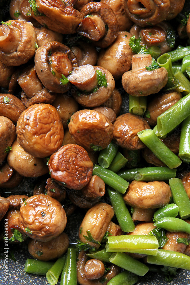 Frying pan with tasty cooked mushrooms and green beans, closeup Frying pan with tasty cooked mushrooms and green beans, closeup