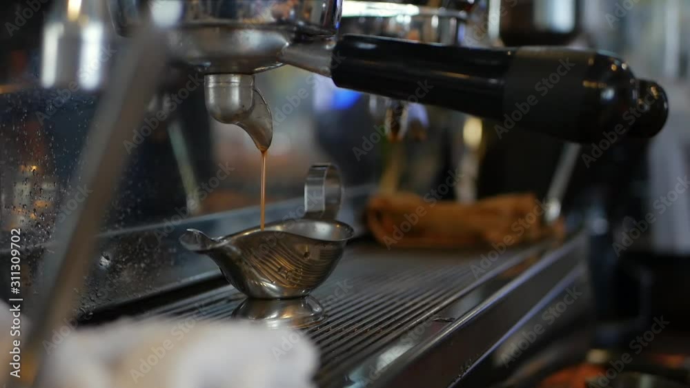 Barista makes coffee by professional coffee machine Barista makes coffee by professional coffee machine