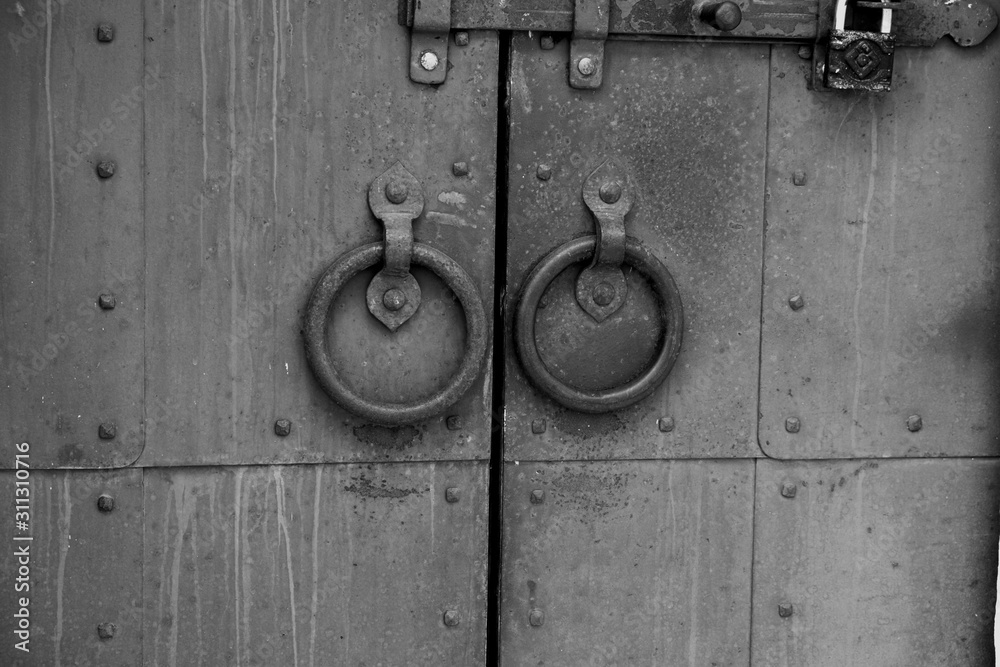 Door handles and deadbolt on the old cathedral door Door handles and deadbolt on the old cathedral door