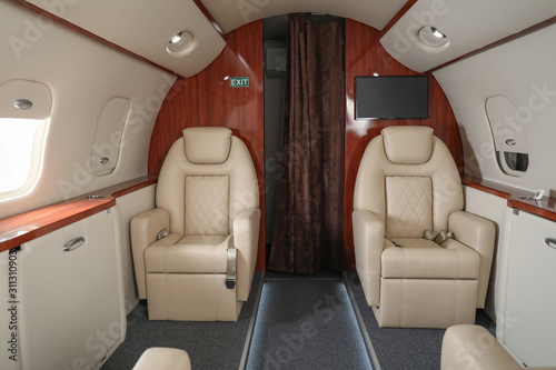 Inside view of modern private airplane © Pixel-Shot