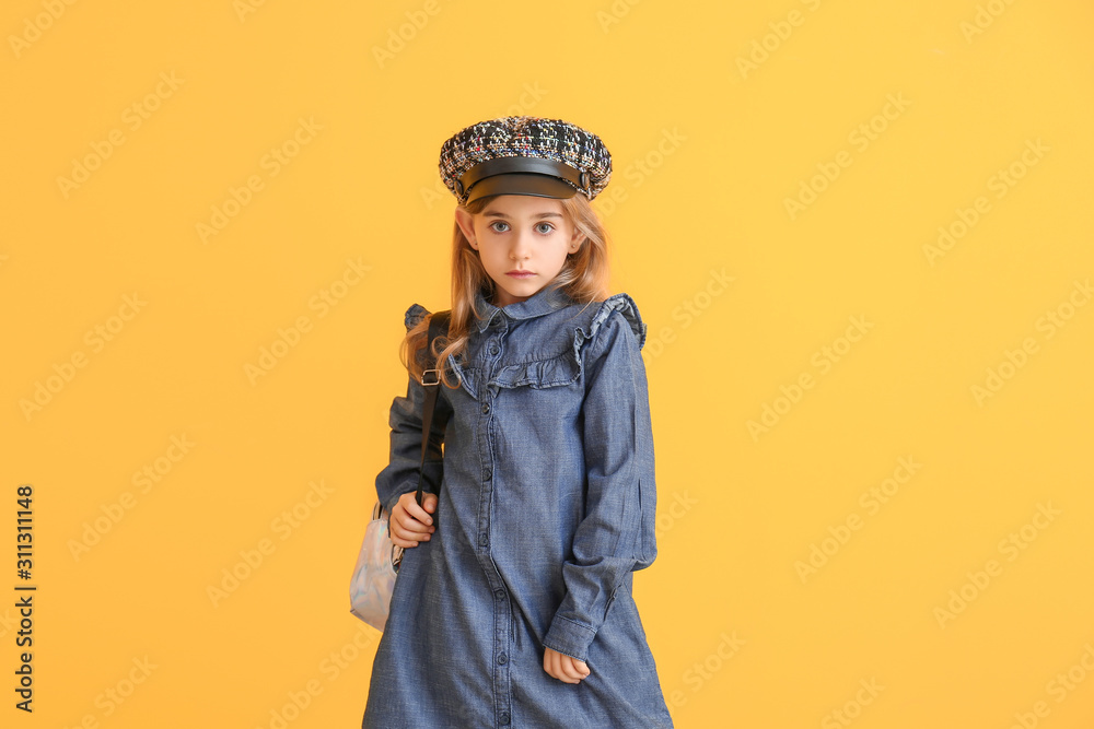 Cute little girl in autumn clothes on color background Cute little girl in autumn clothes on color background