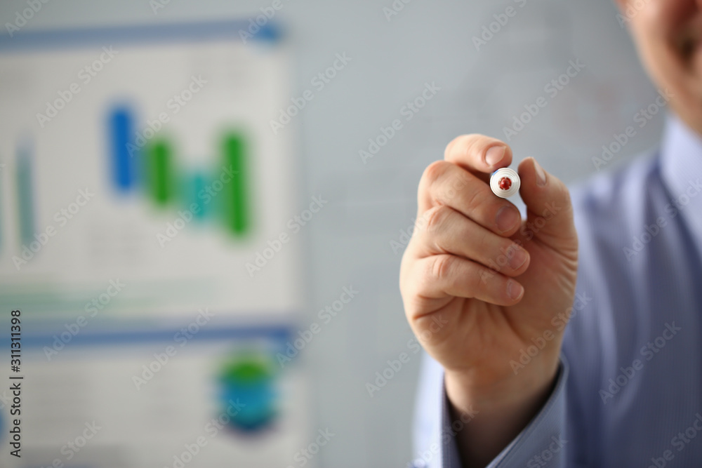 Male hand hold marker on white board problem Male hand hold marker on white board problem