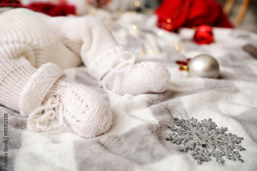 Legs of little baby lying on plaid, closeup Legs of little baby lying on plaid, closeup