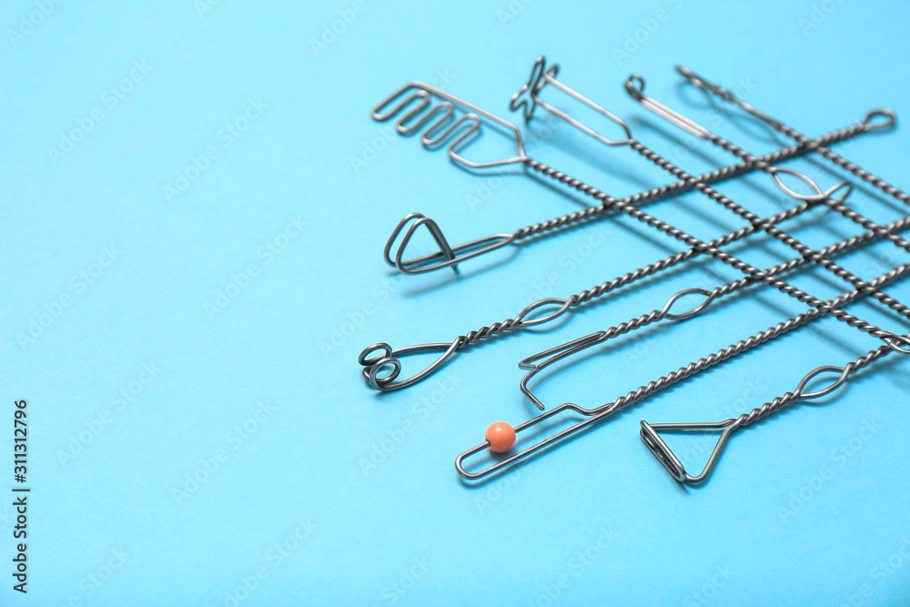 Fototapeta premium Set of logopedic probes for speech therapy on light blue background