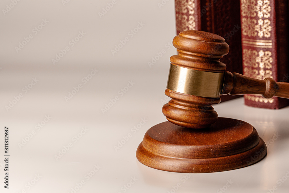 Judge gavel and legal book close up on table Judge gavel and legal book close up on table