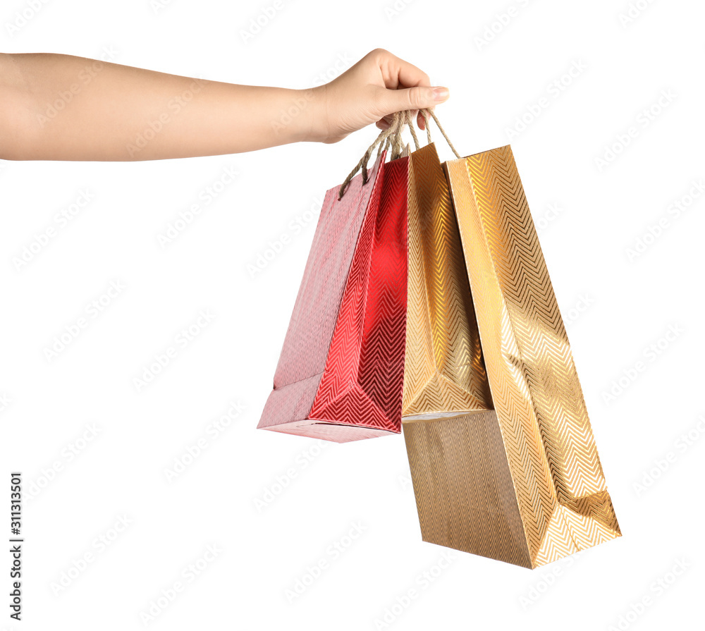 Woman holding paper shopping bags on white background, closeup