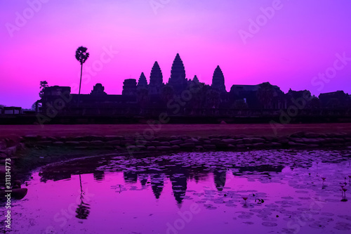 Sunrise Purple bathing pool of Angkor Wat facade silhouette part of the Angkor Cambodia. © Emoji Smileys People