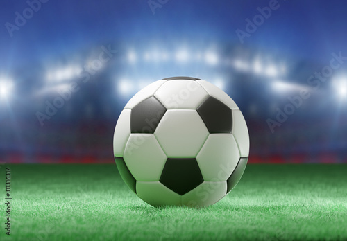 Football ball on the field of a stadium - 3d rendering