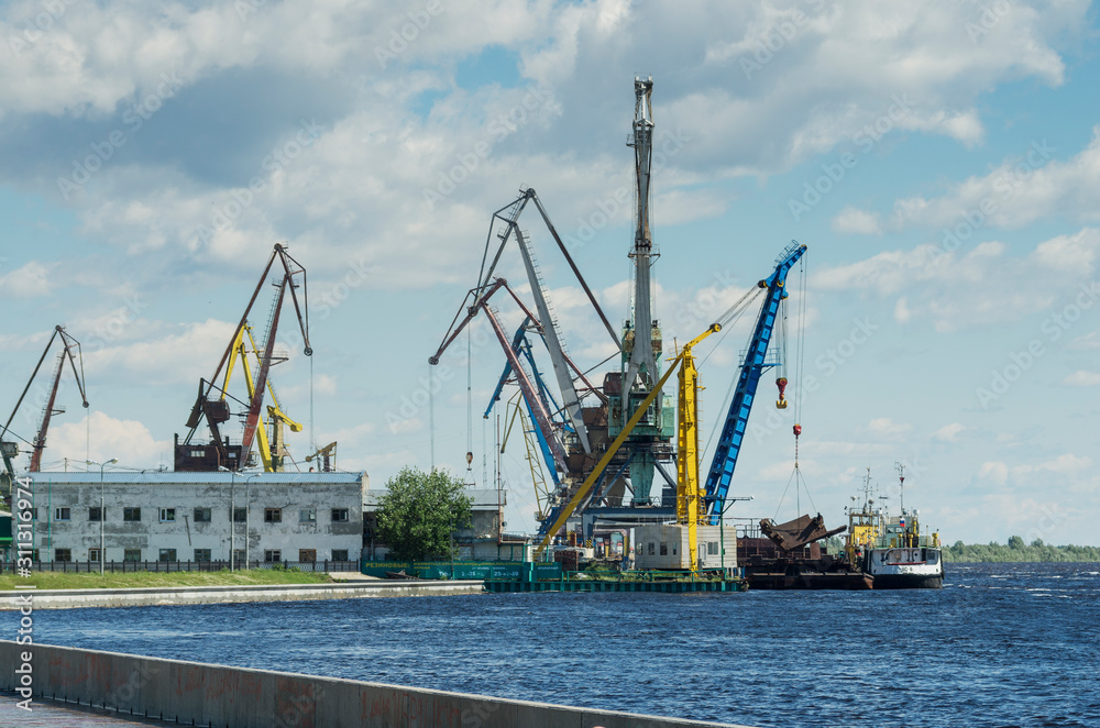 Surgut, river port. Harbor cranes.