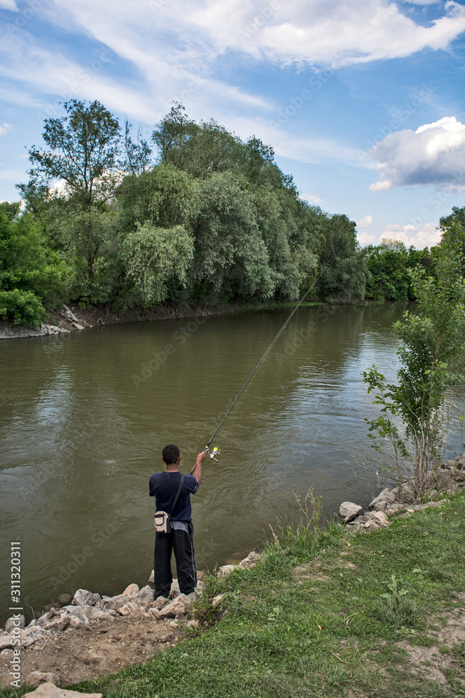 Angler casts the hook Angler casts the hook